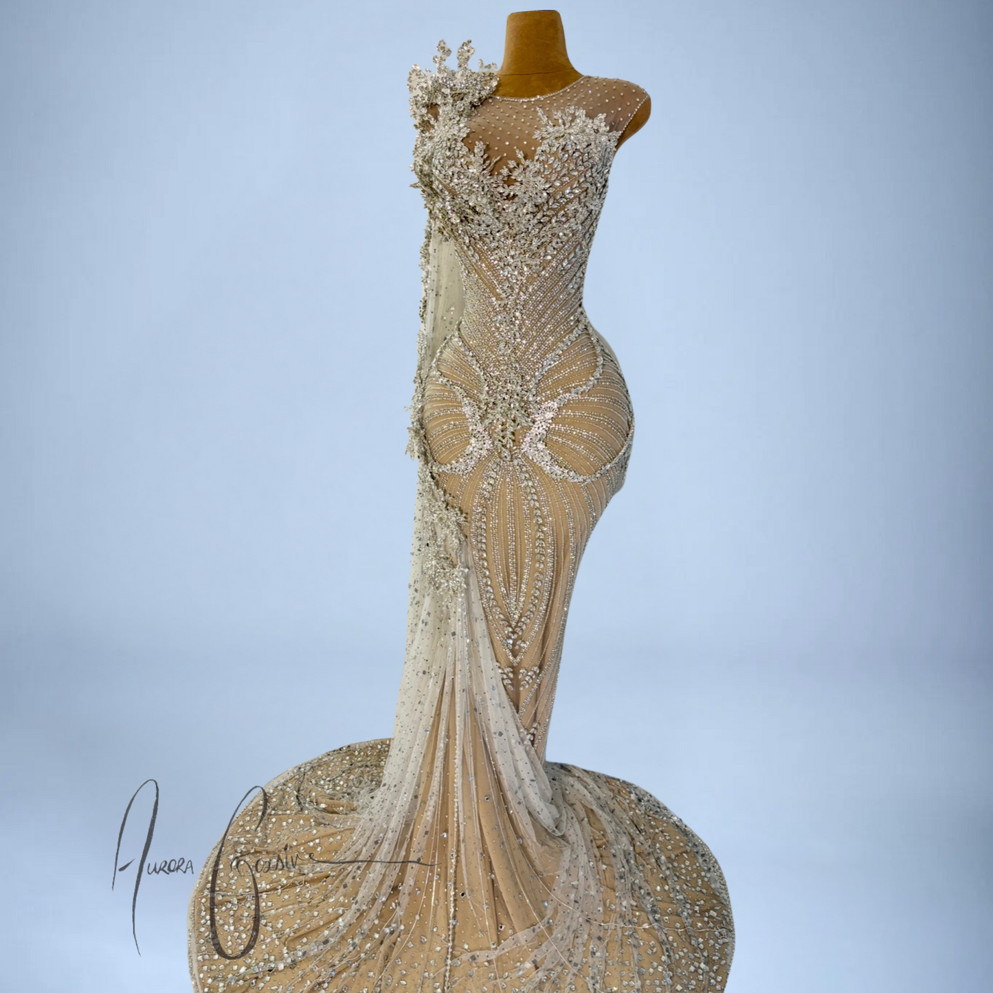 Aurienne nude and off-white gown highlighting 3D embroidery, hourglass beading, and sheer tulle overlay
