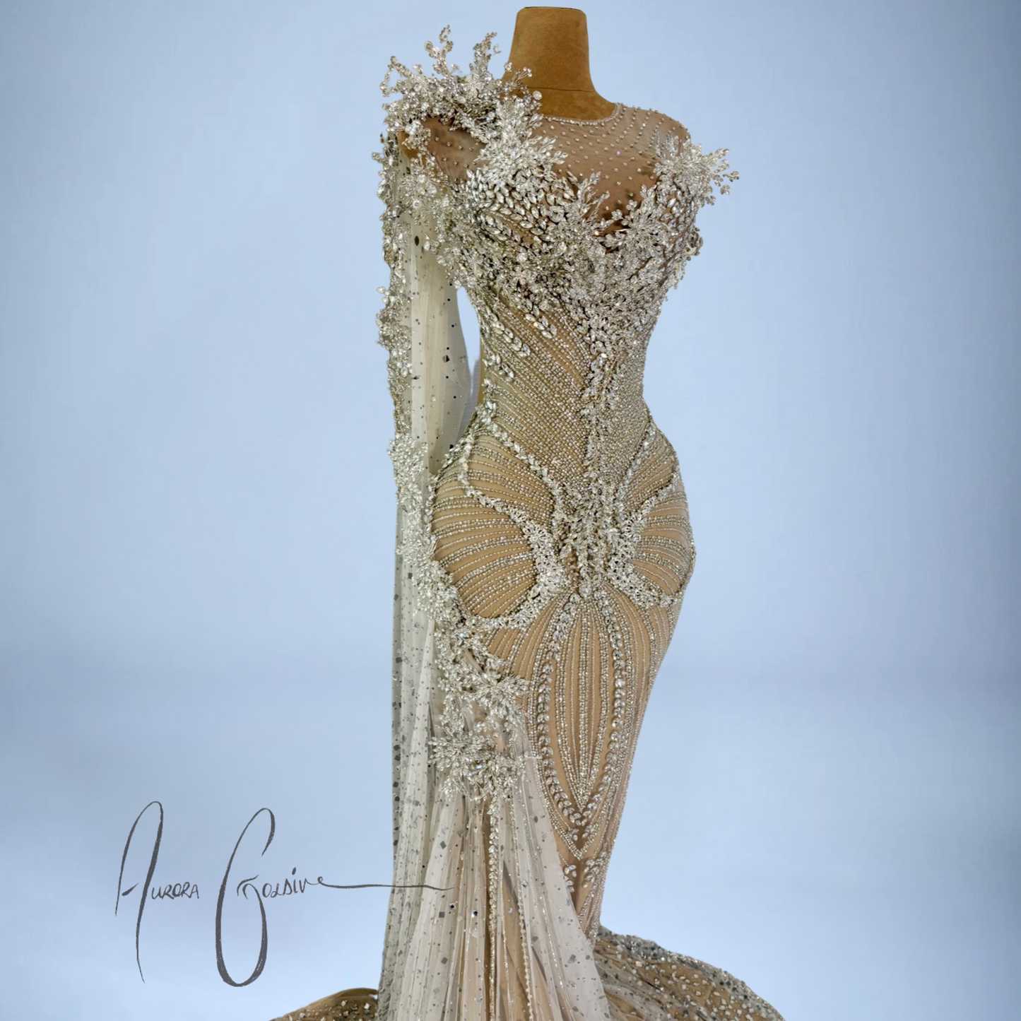 Side profile of Aurienne luxury gown with sculpted waistline, gemstone-studded tulle, and shoulder appliqué