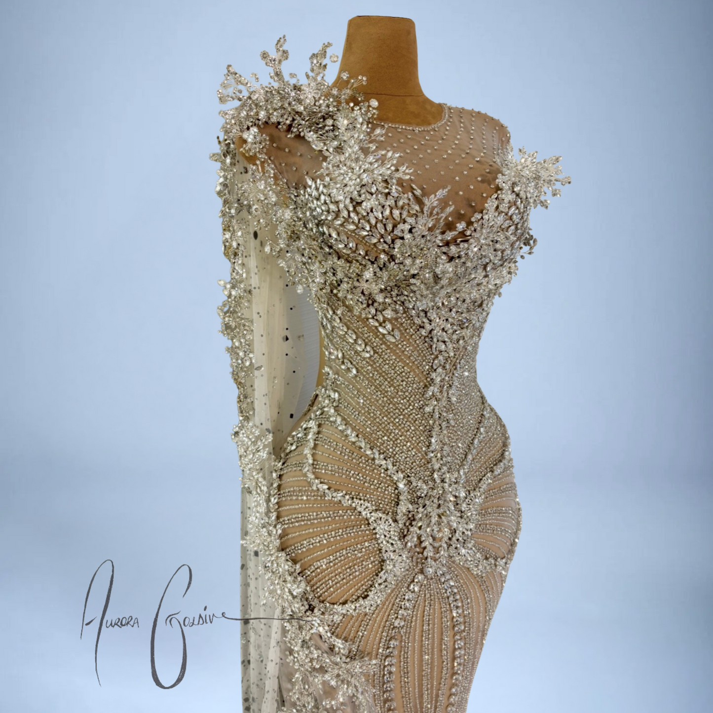 Detailed view of 3D floral appliqué and pearl-studded neckline on Aurienne couture gown