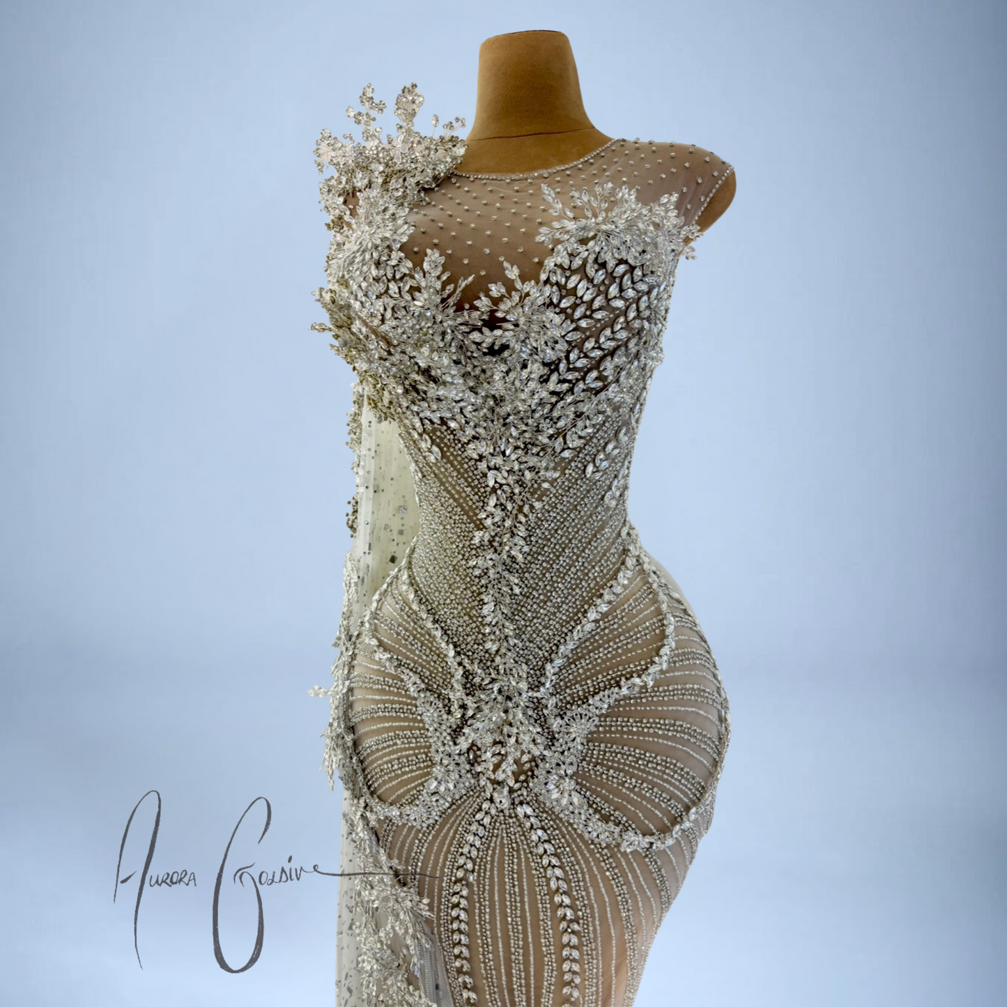 Zoomed-in detail of shimmering beadwork, floral crystals, and body-contouring embellishments on Aurienne gown