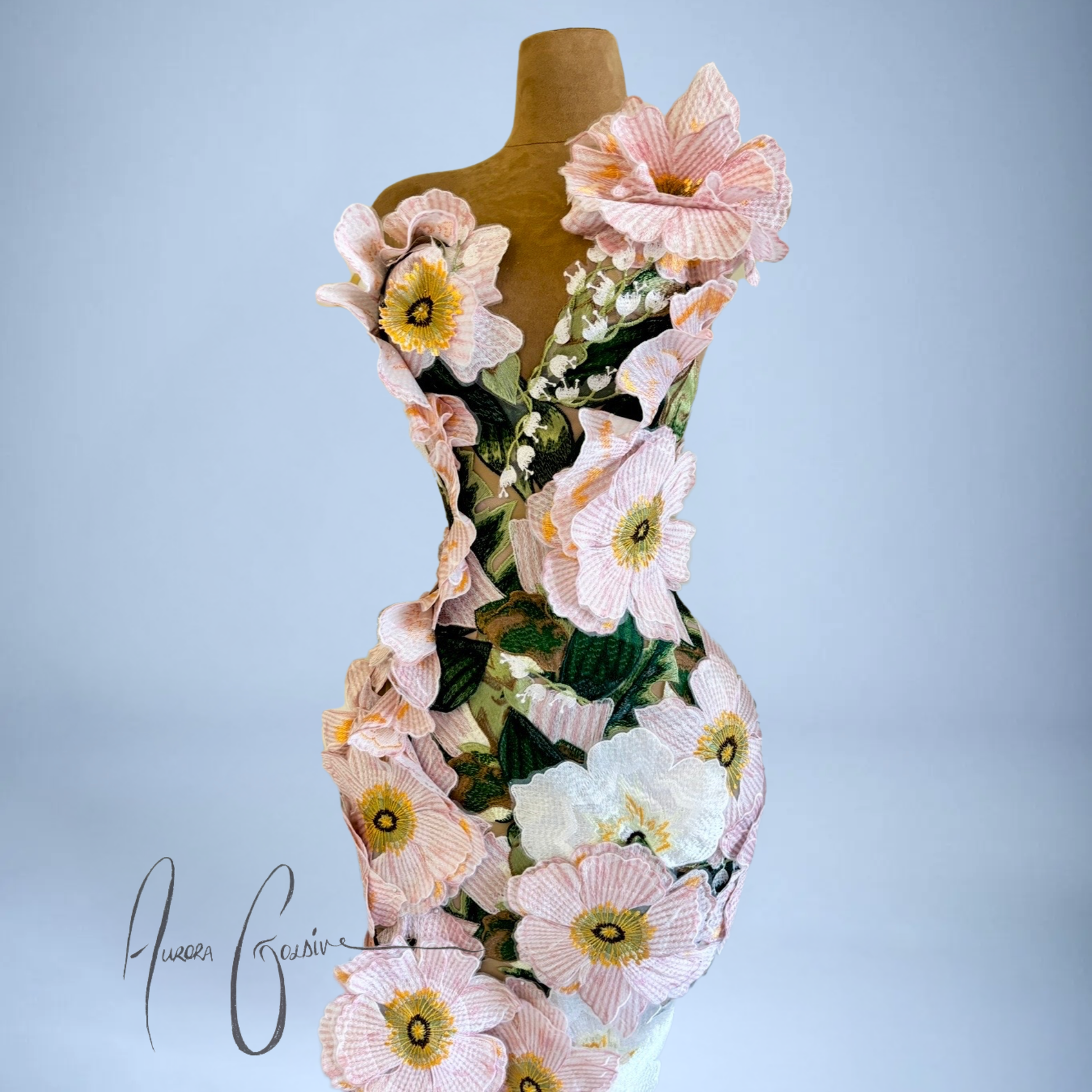 Side view of Amelia Gown pink floral mermaid wedding dress with dimensional floral appliqué detailing