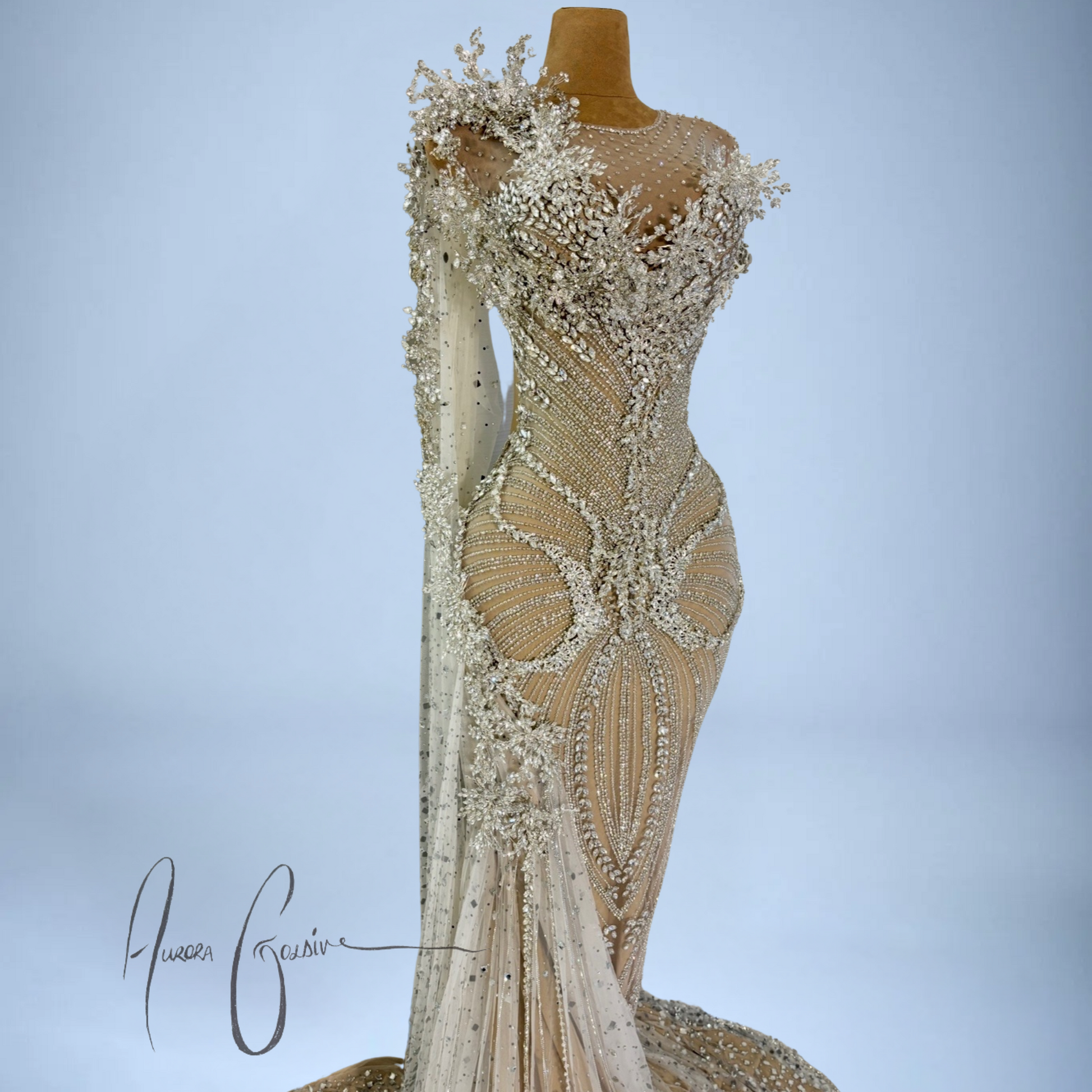 Side profile of Aurienne luxury gown with sculpted waistline, gemstone-studded tulle, and shoulder appliqué