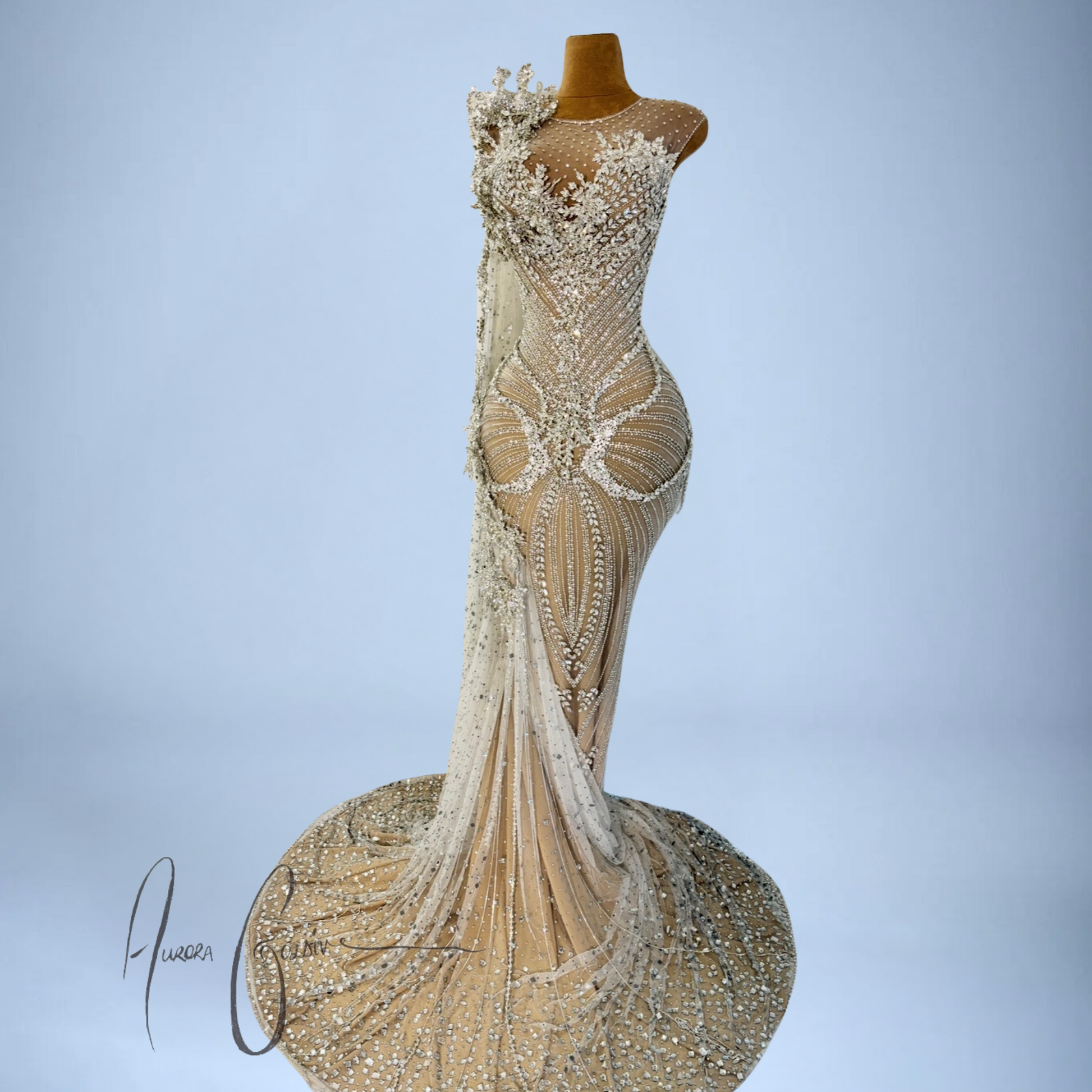 Front-facing view of Aurienne hand-beaded mermaid dress with dramatic trailing rhinestone veil