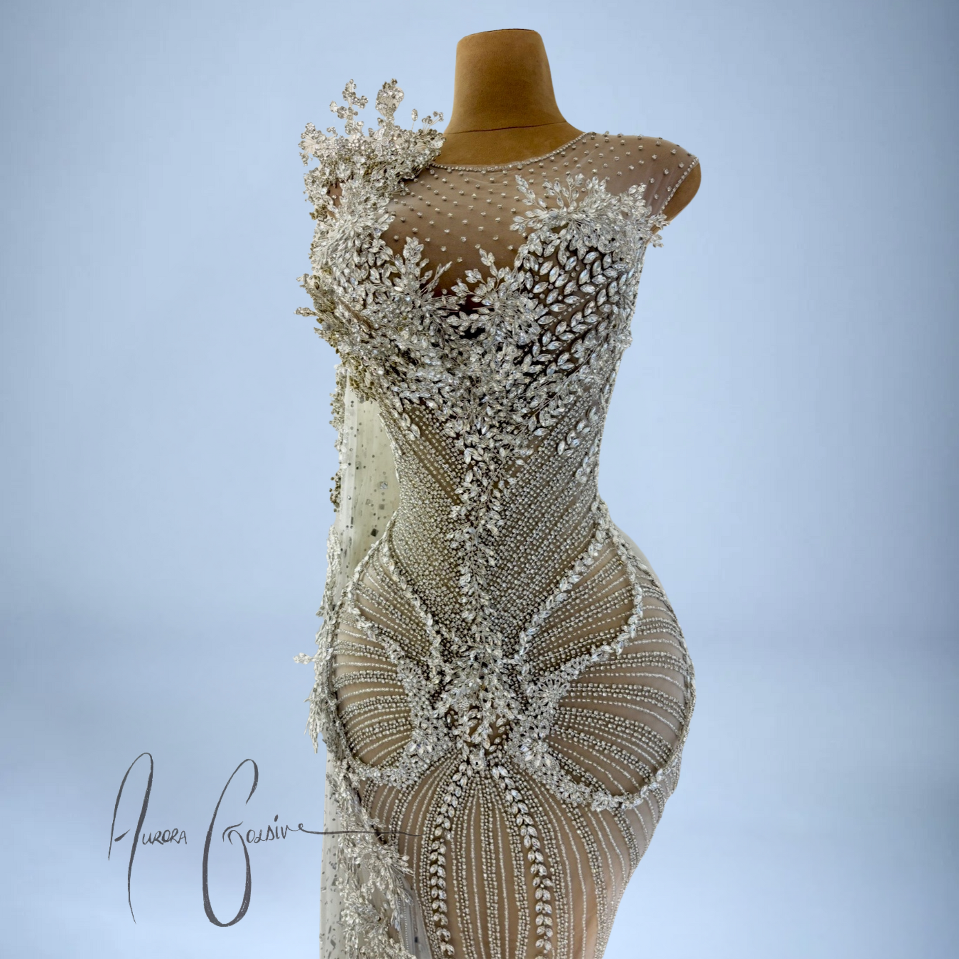 Zoomed-in detail of shimmering beadwork, floral crystals, and body-contouring embellishments on Aurienne gown
